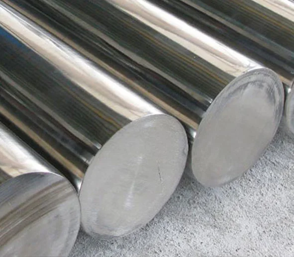 Polished stainless steel round bars stacked closely together
