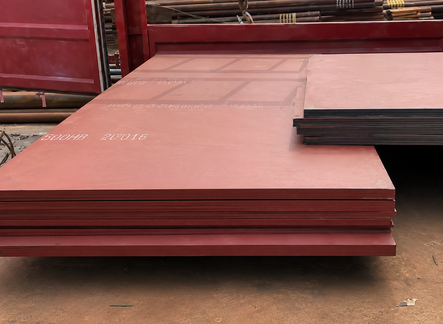 Stacked 500 HB abrasion resistant steel plates in a warehouse