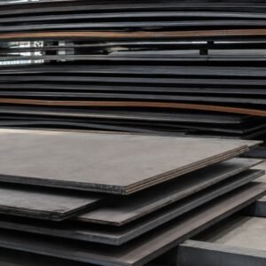Staples of EN 10025-2 structural steel plates stored in a warehouse